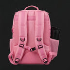 AYRON Sac Athlète 25L Rose — porté par un athlète en déplacement